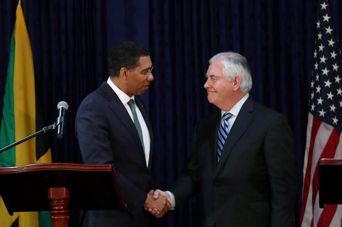 Jamaica's Prime Minister Holness and U.S. Secretary of State Tillerson shake hands, in Kingston
