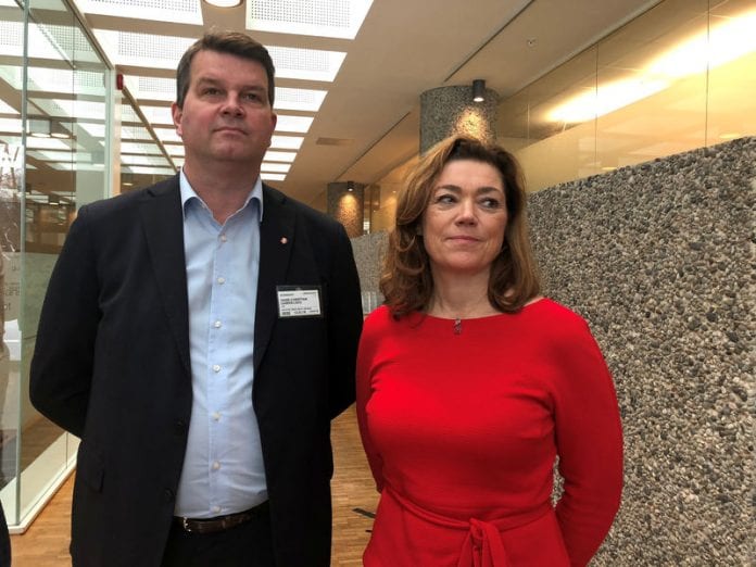 Norway's Confederation of Trade Unions (LO) leader Hans-Christian Gabrielsen and Confederation of Norwegian Enterprise (NHO) Chief Executive Kristin Skogen Lund (right) pose at the start of wage talks in Oslo, March 12, 2018