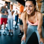 Close up image of attractive fit woman in gym