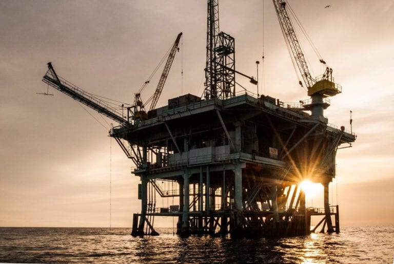 Oil holds near three-month high as U.S. crude stockpiles shrink